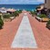 A brick walkway leading to the water of a coastal town